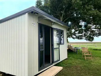 A cabin used by an orchard as a site office